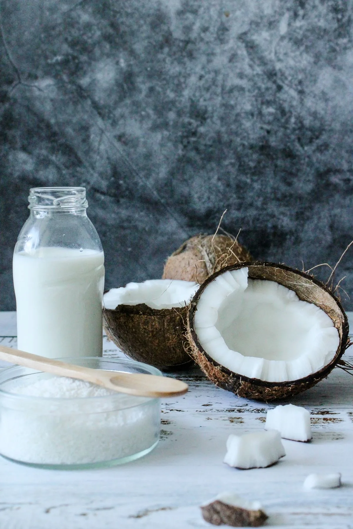 Coconut milk and opened coconuts